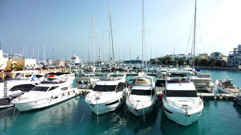Drone flying over ships, yachts and boats in the old port in Limassol in Cyprus on a sunny spring day. Drone flying over ships, yachts and boats in the old port in Limassol in Cyprus on a sunny spring day.