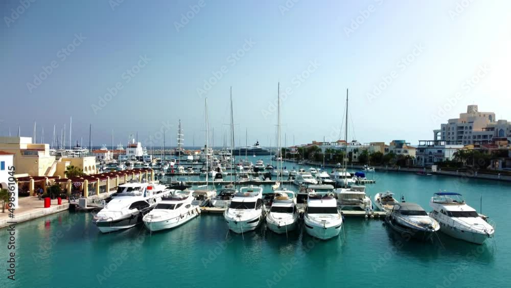 Drone flying over ships, yachts and boats in the old port in Limassol in Cyprus on a sunny spring day. Drone flying over ships, yachts and boats in the old port in Limassol in Cyprus on a sunny spring day.
