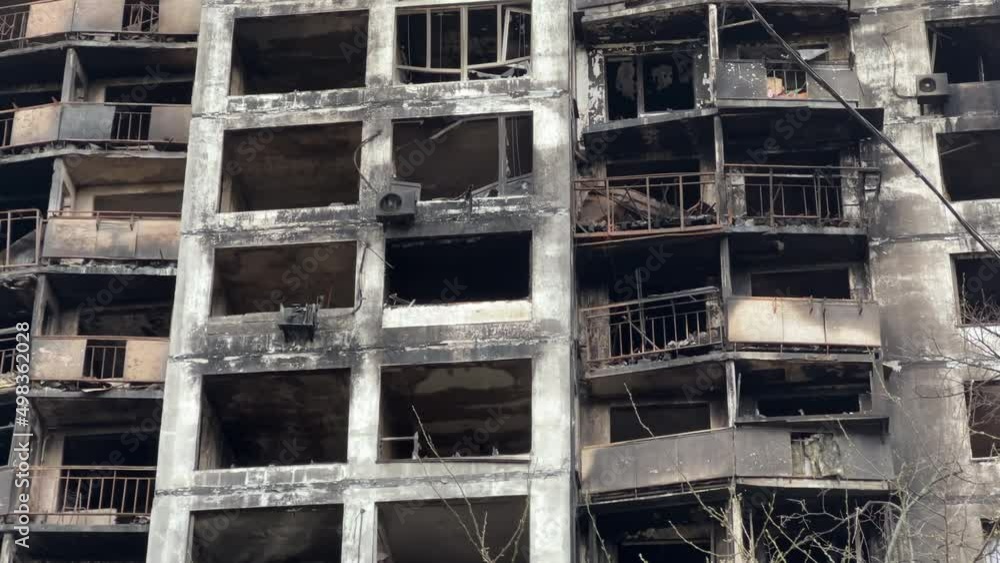 Burnt destroyed facade with broken windows of a high-rise apartment building in Kyiv after a missile strike during Ukraine's war with Russia in 2022 Burnt destroyed facade with broken windows of a high-rise apartment building in Kyiv after a missile strike during Ukraine's war with Russia in 2022