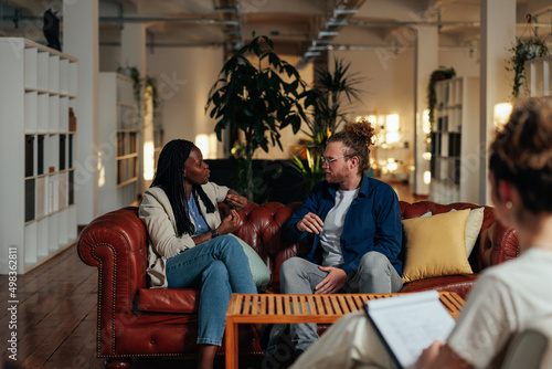 Biracial couple having a consultation with a specialist