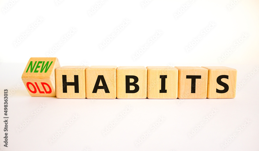 New or old habits symbol. Turned wooden cubes and changed concept words Old habits to New habits. Beautiful white table white background. Business old or new habits concept. Copy space. New or old habits symbol. Turned wooden cubes and changed concept words Old habits to New habits. Beautiful white table white background. Business old or new habits concept. Copy space.