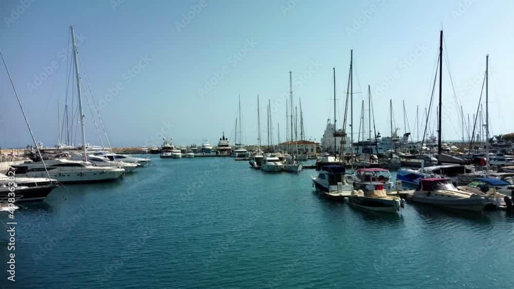 Drone flying over ships, yachts and boats in the old port in Limassol in Cyprus on a sunny spring day. Drone flying over ships, yachts and boats in the old port in Limassol in Cyprus on a sunny spring day.