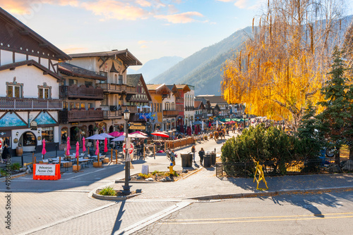Autumn afternoon at the Bavarian themed village of Leavenworth, Washington, in the Inland Northwest of the United States, with themed sidewalk cafes and shops along the pedestrian only main street.	
 photo