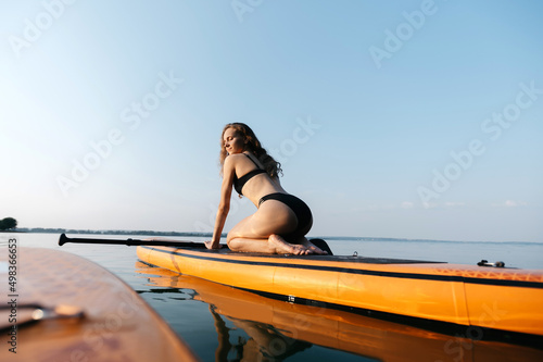 athletic young woman sitting on the SAP board . © yurolaitsalbert