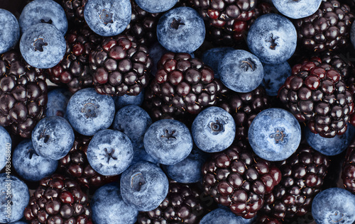background of fresh blueberries and blackberries