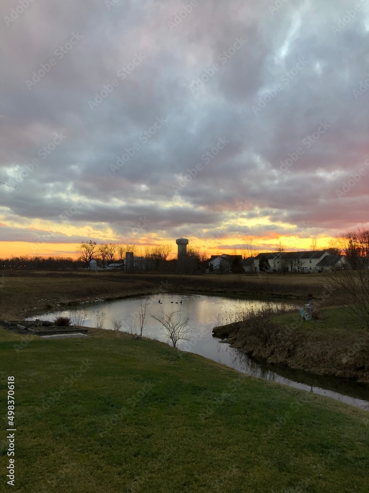 Naklejka premium sunset over the river