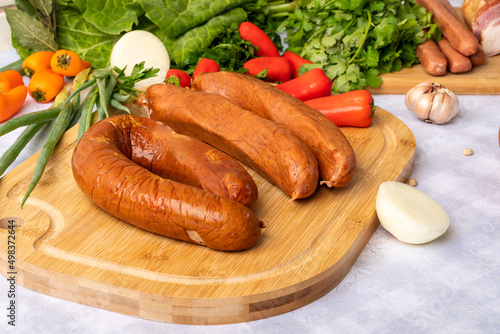  ingredients for preparing a recipe, sausage, parsley, on a table