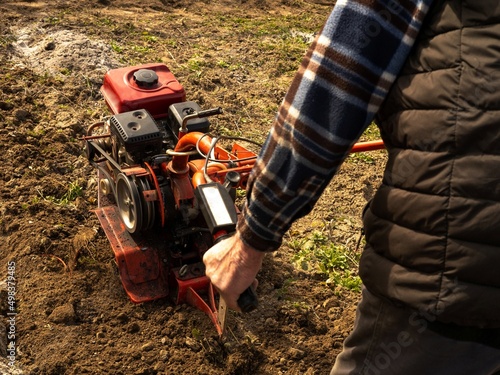 a man is cultivating a garden