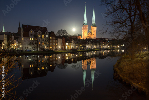 evening view of the center of Lübeck with reflection on the water surface