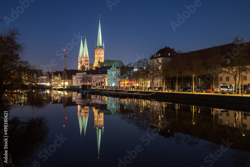 evening view of the center of Lübeck with reflection on the water surface