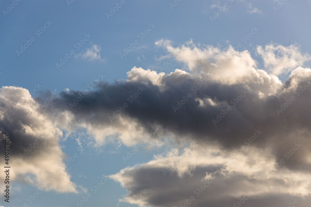 Obraz premium Infinite Horizons: Close-Up of a Cloud on a Blue Sky for Sky Replacement