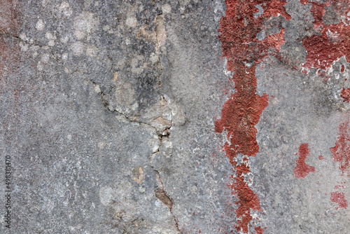 Red concrete wall weathered and decayed texture