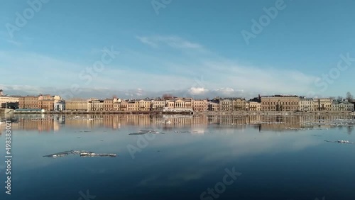 St. Petersburg, Russia,The view of Angliyskaya Naberezhnaya (English embankment) architectural ensemble and its reflection from the other bank of the Neva river and floating ice on the river