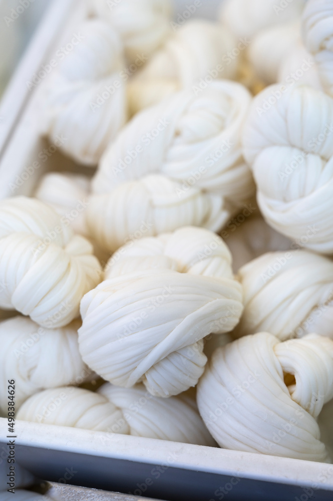 White soft braid cheese on market display White soft braid cheese on market display