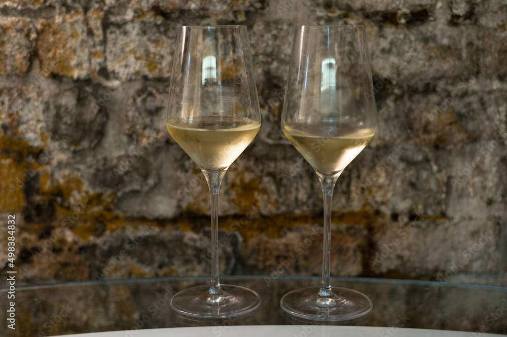 Tasting of brut champagne sparkling wine produced by traditional method in underground caves Tasting of brut champagne sparkling wine produced by traditional method in underground caves