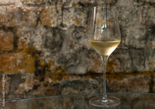 Tasting of brut champagne sparkling wine produced by traditional method in underground caves