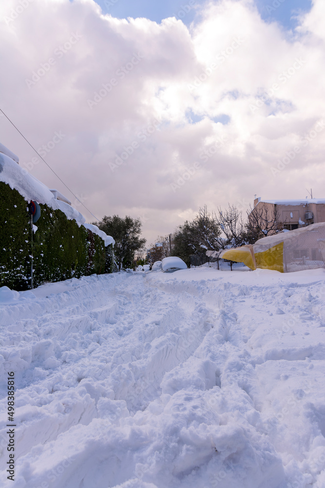 Cars totally covered with snow in Vrilissia district, during snow storm in Athens city, capital of Greece, Europe