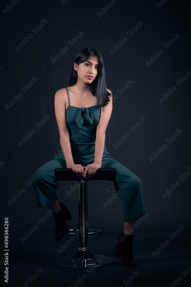 portrait of latina girl in photo studio isolated on black background portrait of latina girl in photo studio isolated on black background