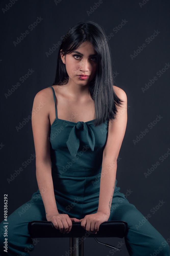 detail of portrait of latina girl in photo studio isolated on black background detail of portrait of latina girl in photo studio isolated on black background