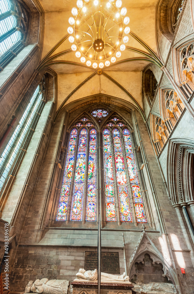Obraz premium Hereford Cathedral,stained glass window and suspended illuminated lighting,interior,Herefordshire,England,UK.