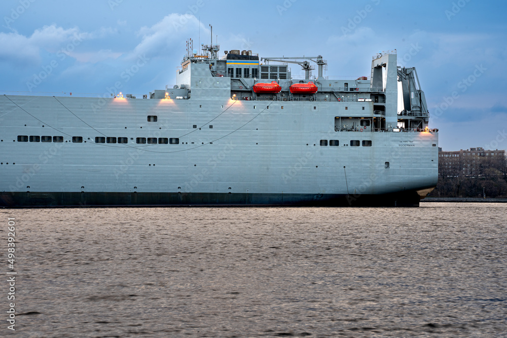 Staten Island, NY - USA - April 10, 2022: Closeup landscape early morning view of the USNS Soderman (T-AKR-317), a Large, Medium-Speed Roll-on Roll-off Ship. tied up in Narrows of New York Harbor.