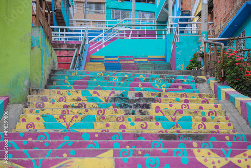 graffitied stairs in a hillside neighborhood © AngelNicolas