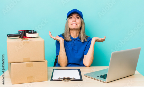 senior gray hair woman feeling puzzled and confused and doubting. employee packer concept photo