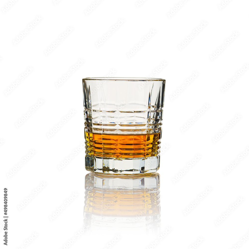 Glass of whisky - without ice and reflection, studio shot. Isolated on white Glass of whisky - without ice and reflection, studio shot. Isolated on white
