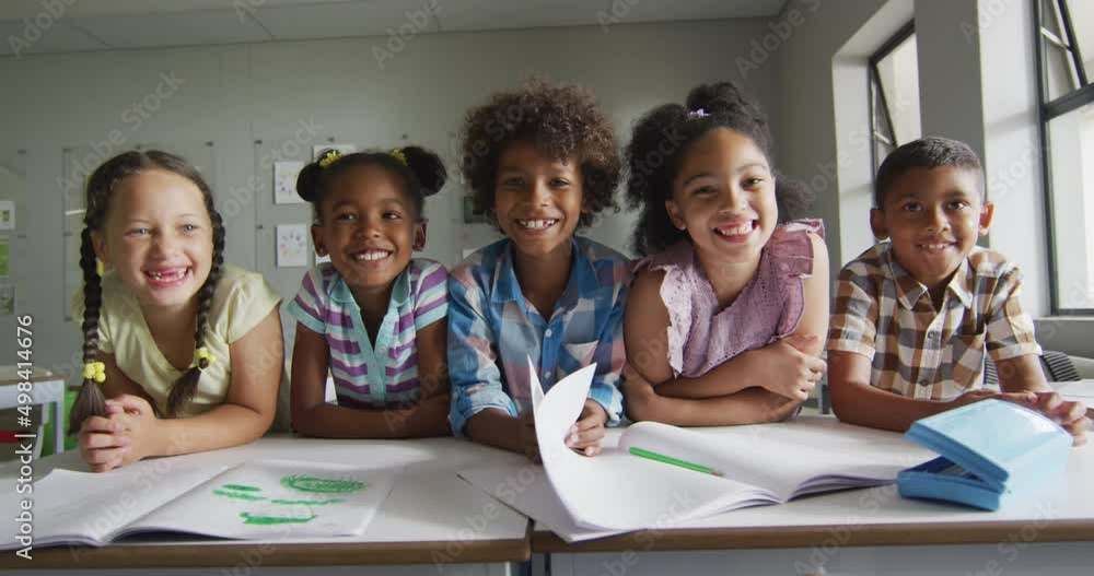 Video of happy diverse pupils learning together in classroom Video of happy diverse pupils learning together in classroom