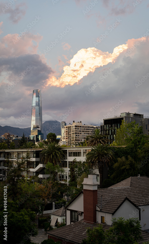 Cloudy sunset over Santiago with buildings and costenera center from the window Cloudy sunset over Santiago with buildings and costenera center from the window