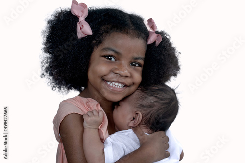 Photos Adorable African older sister cuddling with her toddler baby brother, sweet mome