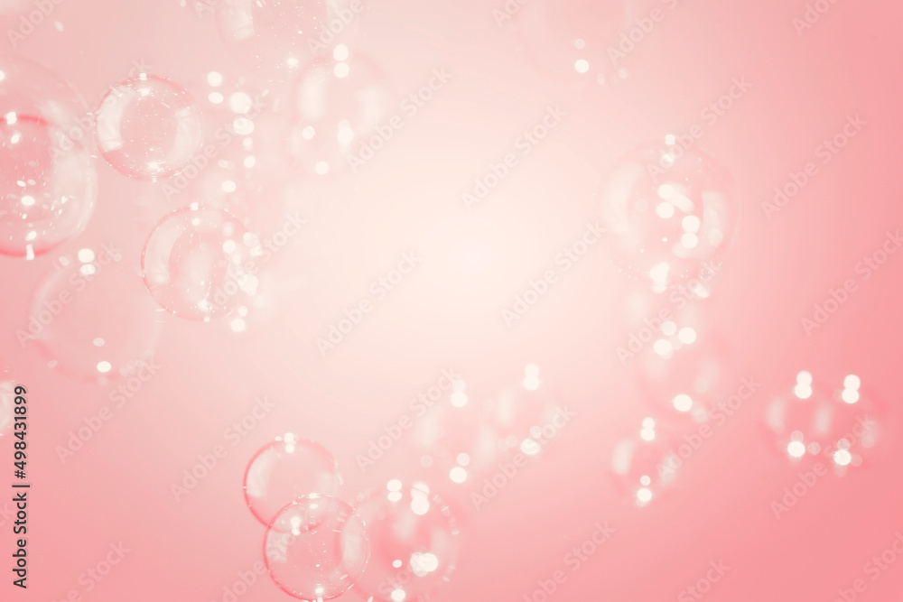 Transparent Shiny Soap Bubbles  Floating on Pink Background. Soap Sud Bubbles Water.