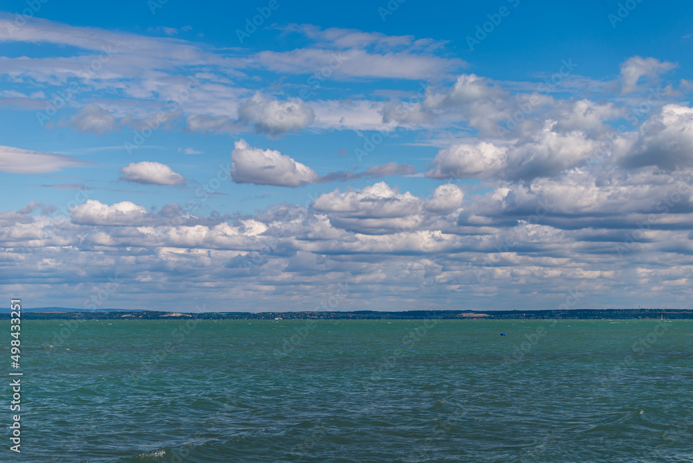 Balaton Lake in Siofok, Hungary. Dramatic Cloudy sky and blue, tourquise water. Balaton Lake in Siofok, Hungary. Dramatic Cloudy sky and blue, tourquise water.