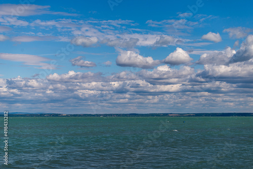 Balaton Lake in Siofok, Hungary. Dramatic Cloudy sky and blue, tourquise water. photo