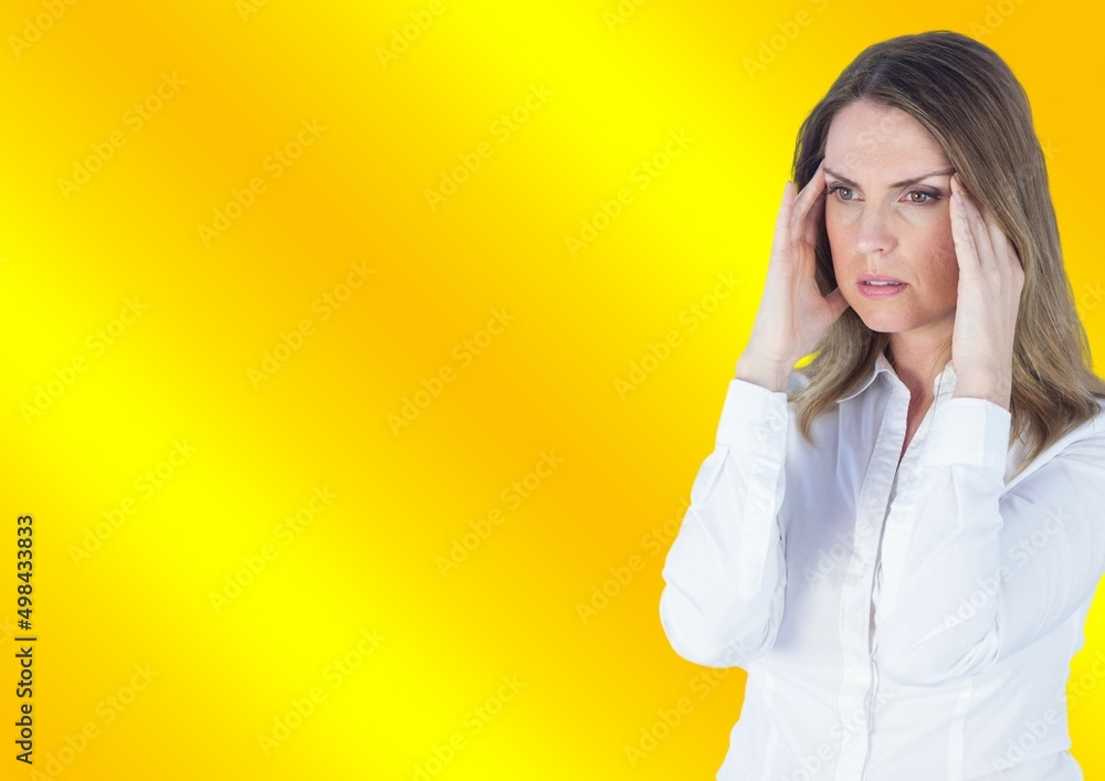 Stressed caucasian woman holding her head against copy space on yellow gradient background Stressed caucasian woman holding her head against copy space on yellow gradient background