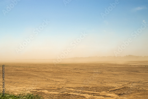 Defocused image. Desert sandstorm. Dust and sand in the air.