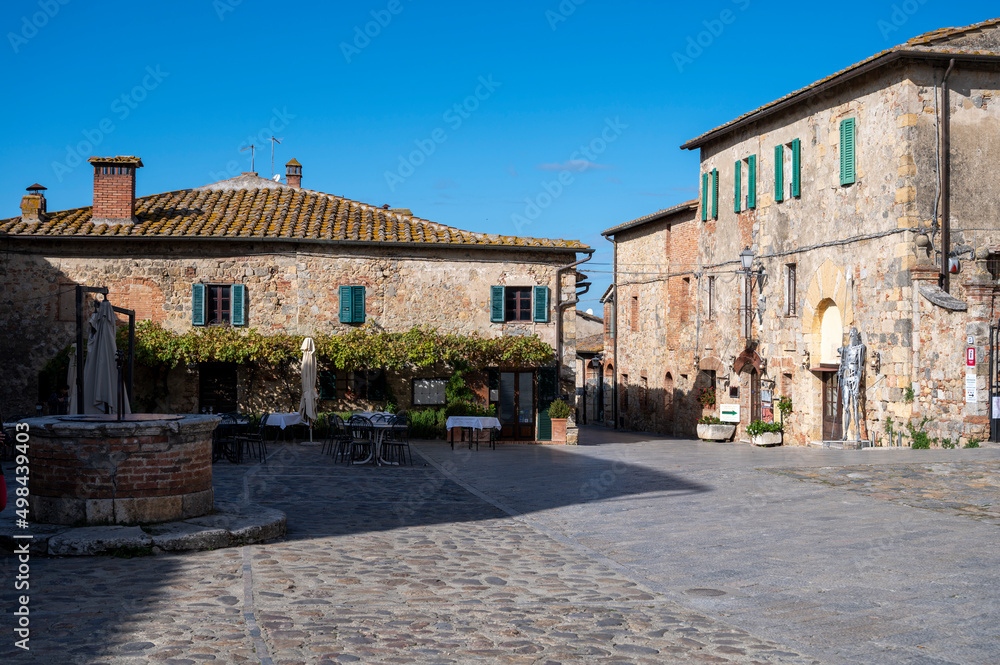 Inside old town walls in medieval fortress town on hilltop Monteriggione in Tuscany, Italy