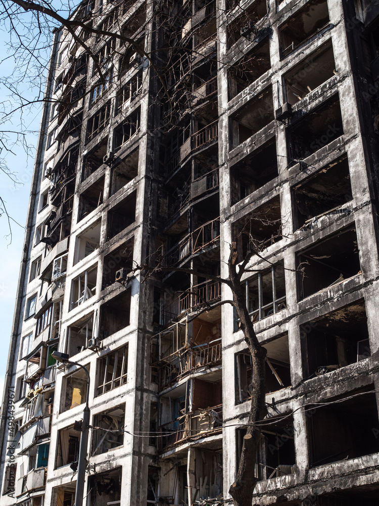 A destroyed multi-storey residential building in the city after a rocket attack. Military attack on civilians. A destroyed multi-storey residential building in the city after a rocket attack. Military attack on civilians.