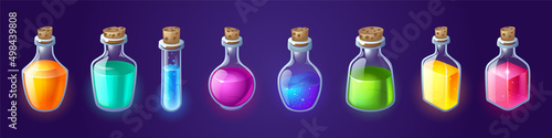 Bottles with magic potion, alchemy elixir or poison. Vector cartoon set of glass jars, vials and flasks with corks and different color liquid potions isolated on blue background