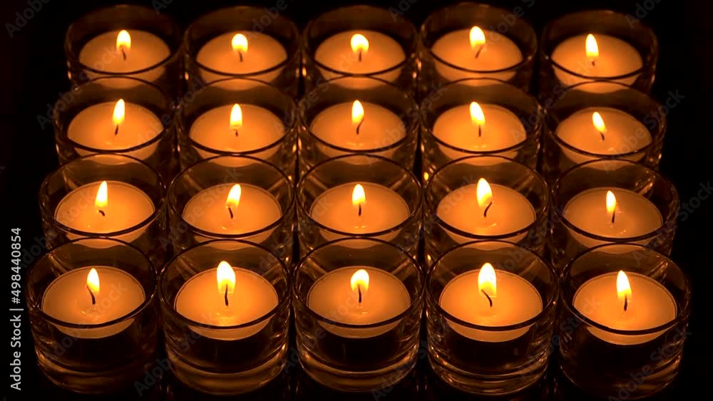 In memoriam. Remembrance candles flickering - Lit for the departed. In memoriam. Remembrance candles flickering - Lit for the departed.