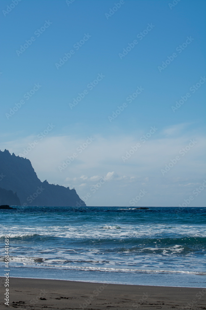 Panoramic view on lava rocks of laya de Almaciga and blue Atlantic ocean, Anaga national park near Tanagana village, North of Tenerife, Canary islands, Spain Panoramic view on lava rocks of laya de Almaciga and blue Atlantic ocean, Anaga national park near Tanagana village, North of Tenerife, Canary islands, Spain