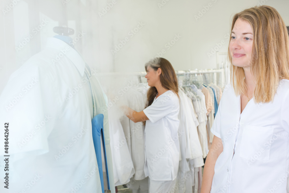 woman laundry worker at the dry cleaners woman laundry worker at the dry cleaners