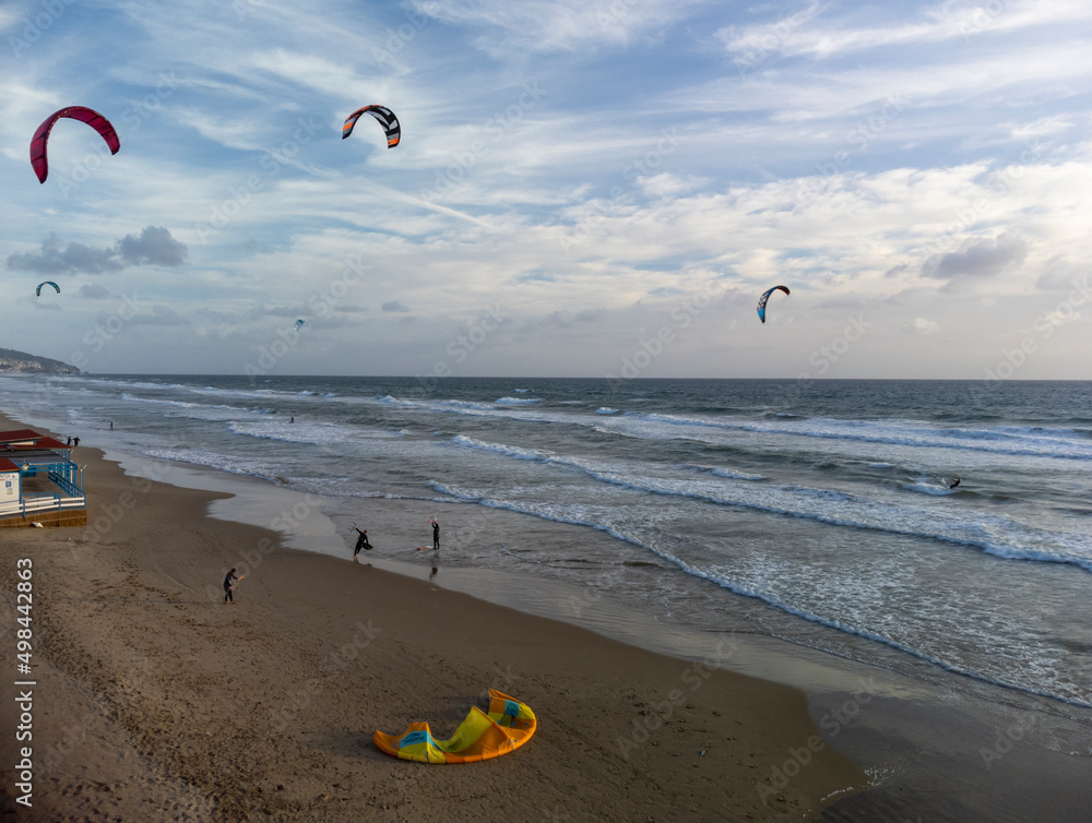 Obraz premium Water sport at cold winter water of Tyrrhenian sea between two touristic towns Sperlonga and Terracina in Lazio, Italy, aerial view
