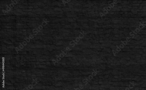 old black painted brick wall for design