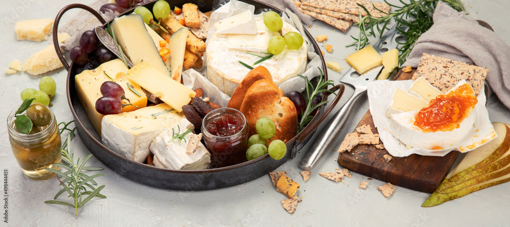 Cheese assortment on light background.