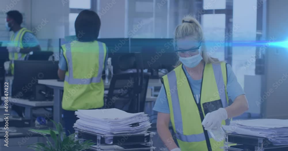 Animation of light spots over caucasian female worker with face mask disinfecting office Animation of light spots over caucasian female worker with face mask disinfecting office