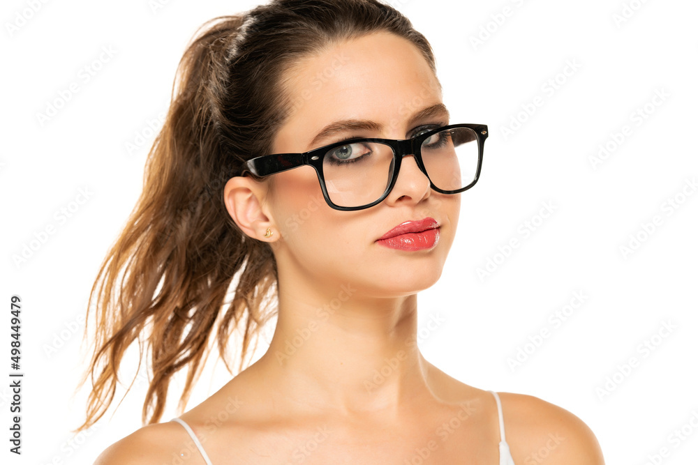 Beautiful woman with make up and glasses on a white background Beautiful woman with make up and glasses on a white background