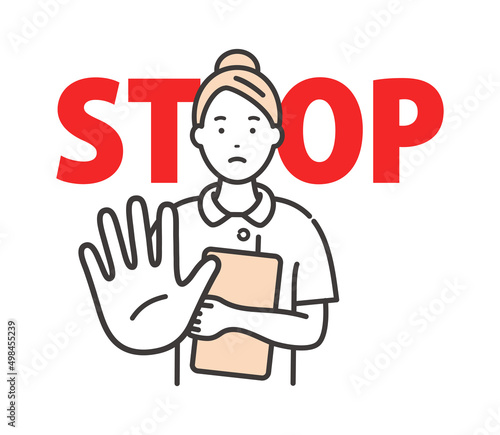 若い女性看護師が相手を制止するポーズ　STOPサイン