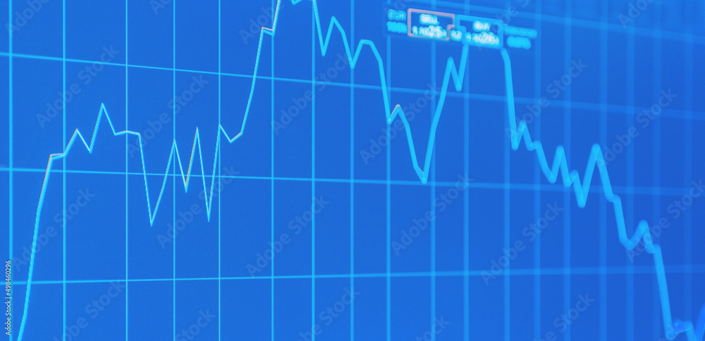 Fototapeta premium Daily trading prices on the online stock market graph showing on blue screen.Daily investor's business everyday life.Banner,selective focus.
