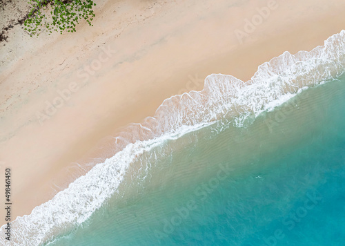 Aerial view of Summer tropical background of water wave on the beach,top view image